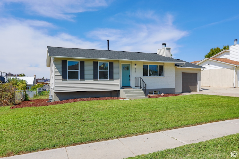 Ranch-style house featuring a chimney, driveway, an attached garage, brick siding, and a shingled roof