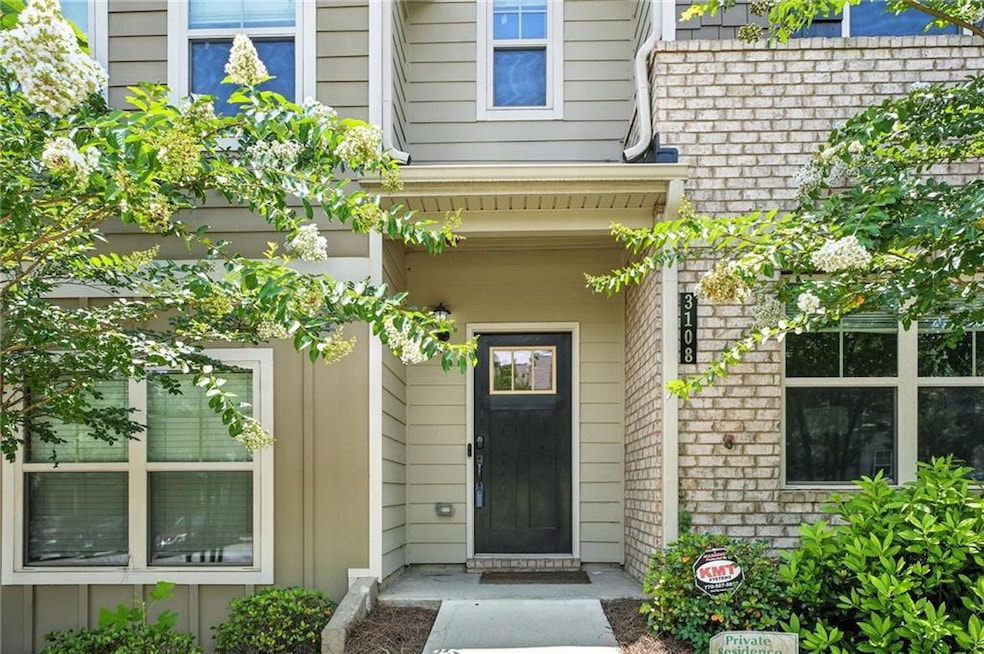 Doorway to property featuring brick siding