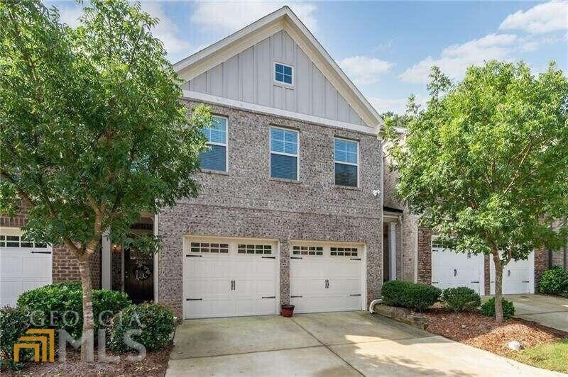 This gorgeous, brick townhome has 3 bedrooms and i