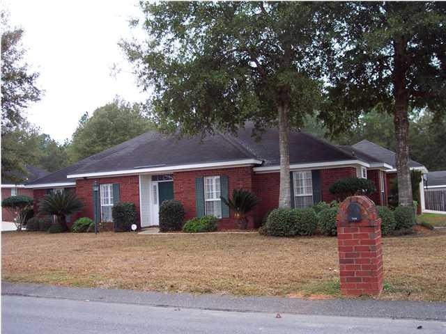 Beautiful brick home has a brick mailbox too.
