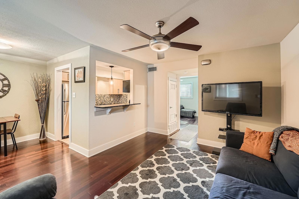 Living room featuring a textured ceiling, ceiling