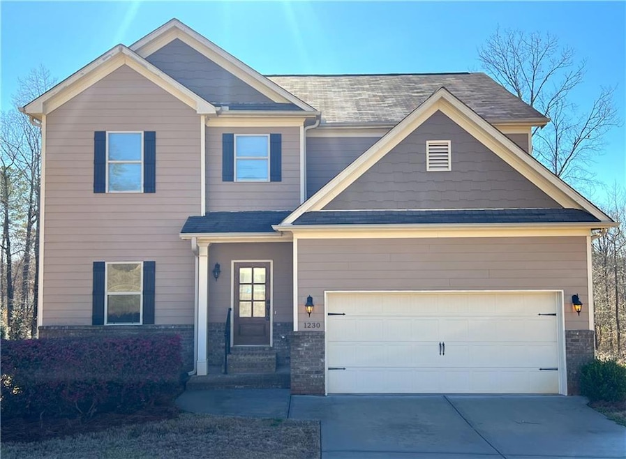 Craftsman-style home featuring a garage