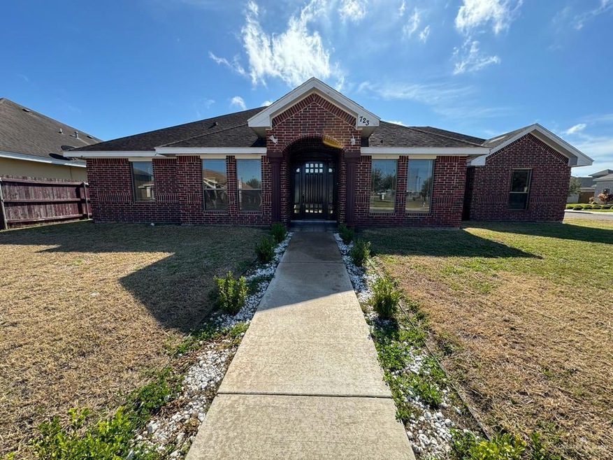 Single story home featuring a front yard