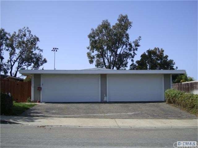 Front of duplex with 2-two car garages