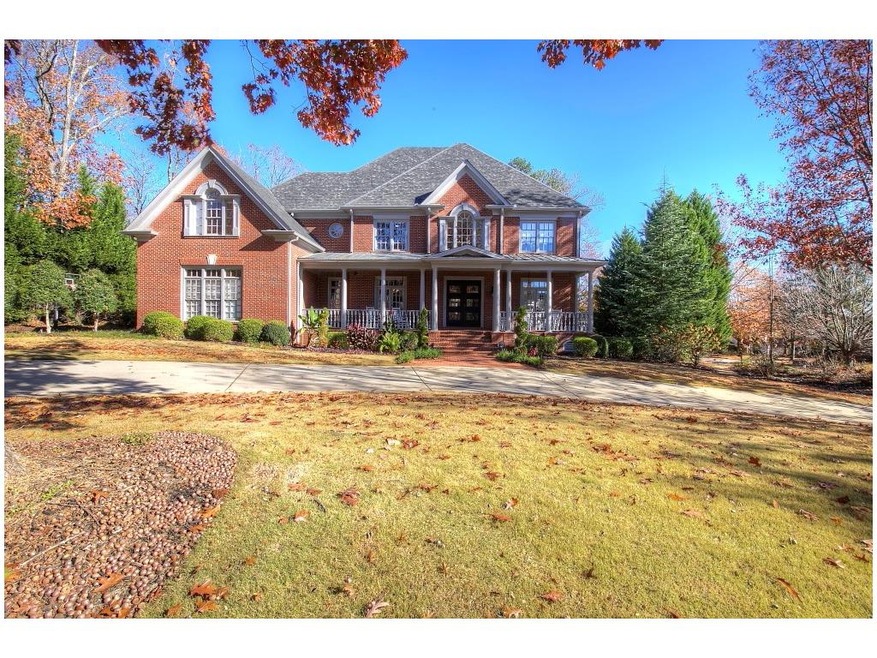 Four sides brick with welcoming front porch opens 