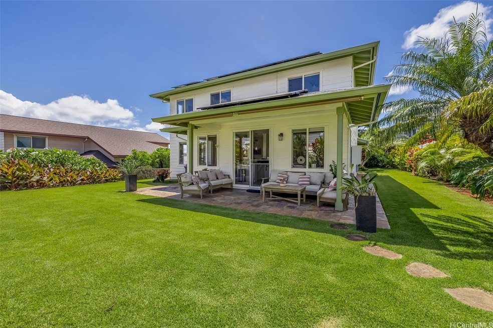 Expansive backyard and side yard filled with lush