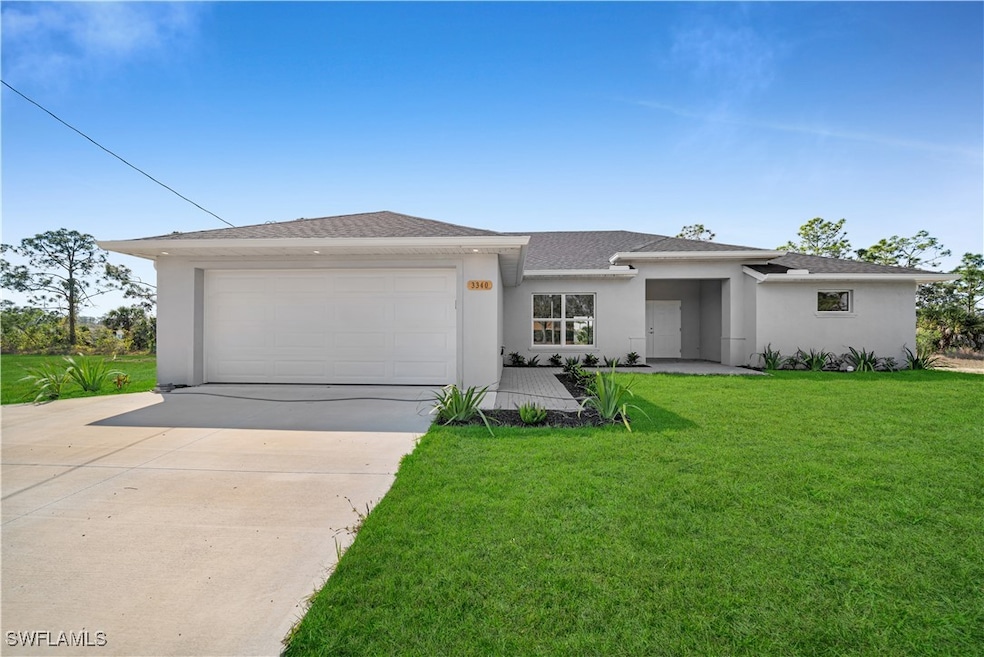 Prairie-style home with an attached garage, a shin