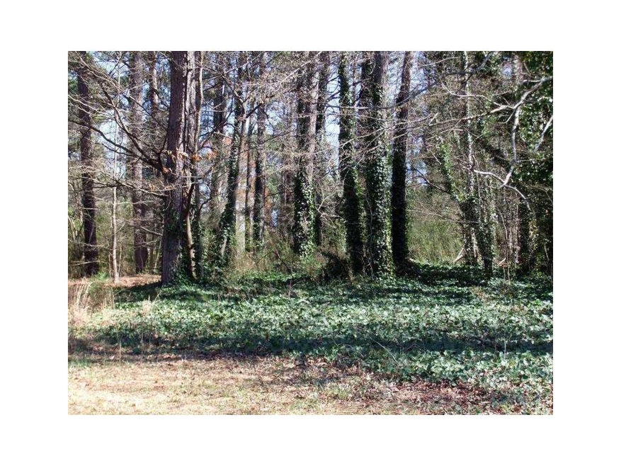 Exterior Front. VIEW OF WOODED LOT