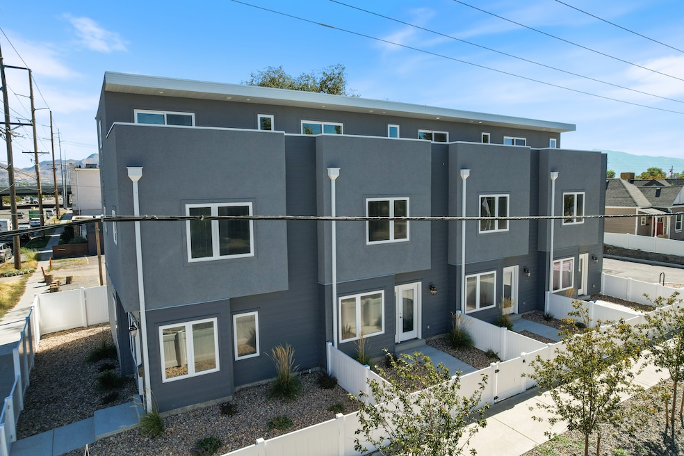 View of front of home featuring a fenced front yard, stucco siding, and a mountain view