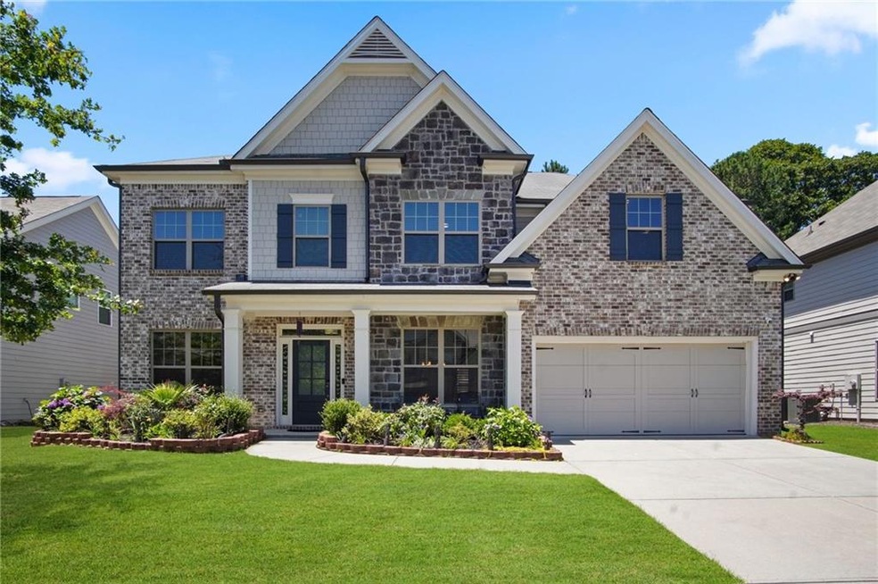 Craftsman-style house featuring a garage and a fro