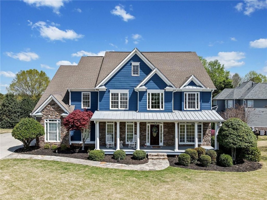 View of front of property featuring stone siding, 