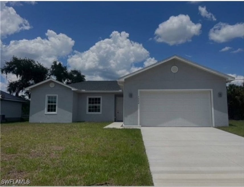 Ranch-style house with stucco siding, a garage, concrete driveway, and a front lawn