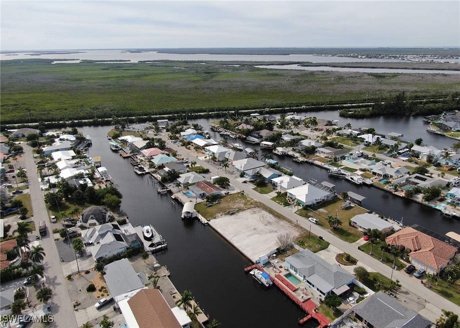 Drone / aerial view with a water view and a reside