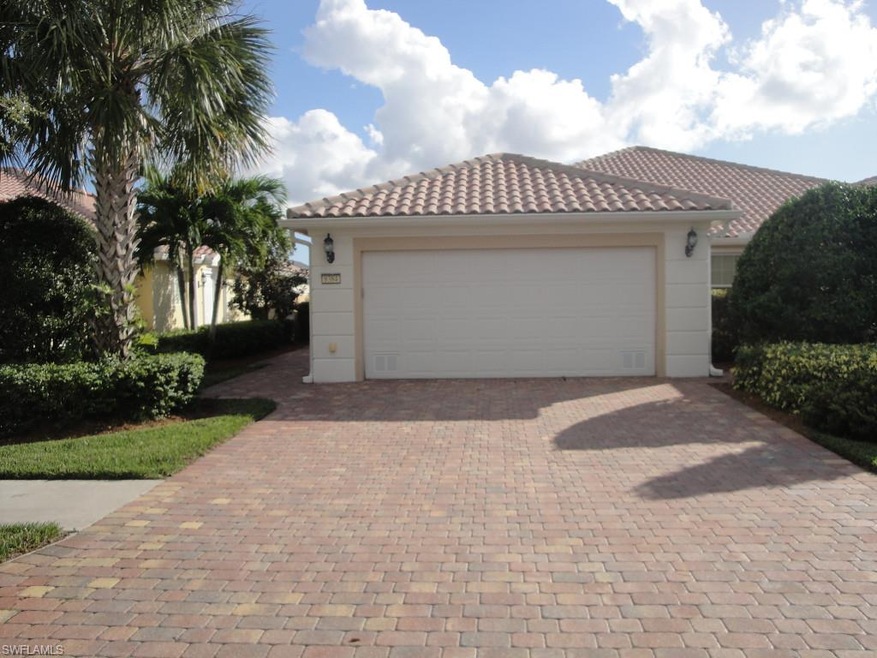 Welcoming entrance with custom width paver brick driveway.