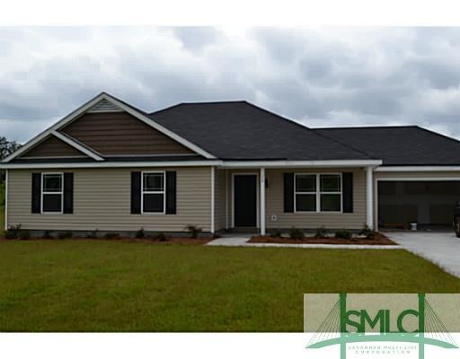 Exterior Front. Covered front porch and double-car
