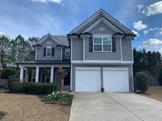 View of front of property featuring a garage