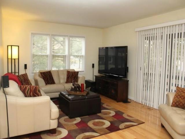 Hardwood Floors in Living Room with Slider to Cove