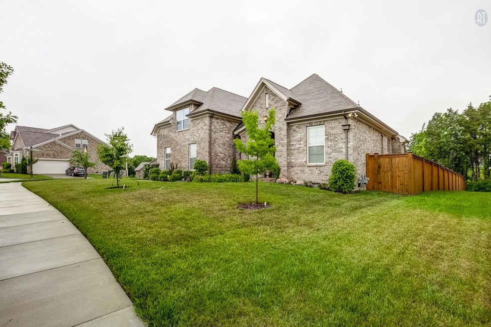 One of the largest lots available in Burkitt Place!  Beautiful landscaping on all sides!