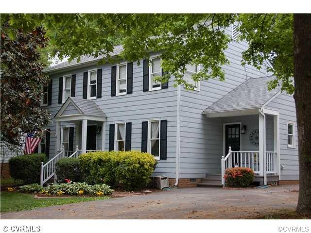 Front Elevation with quaint covered side entry por