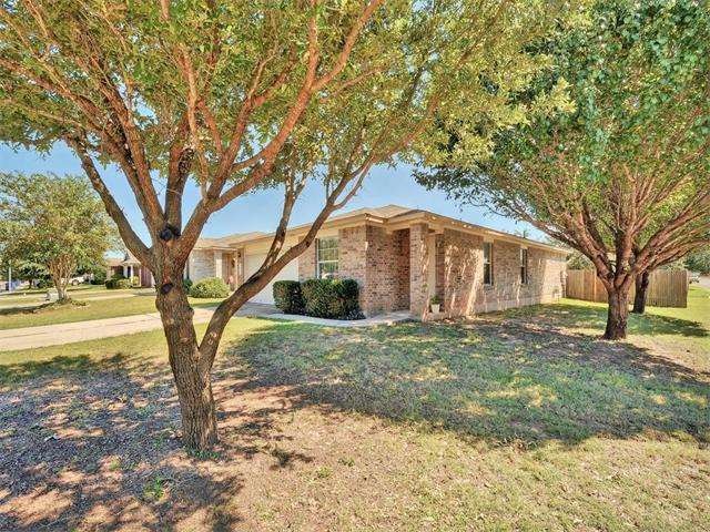 Spacious corner lot with mature shade trees.