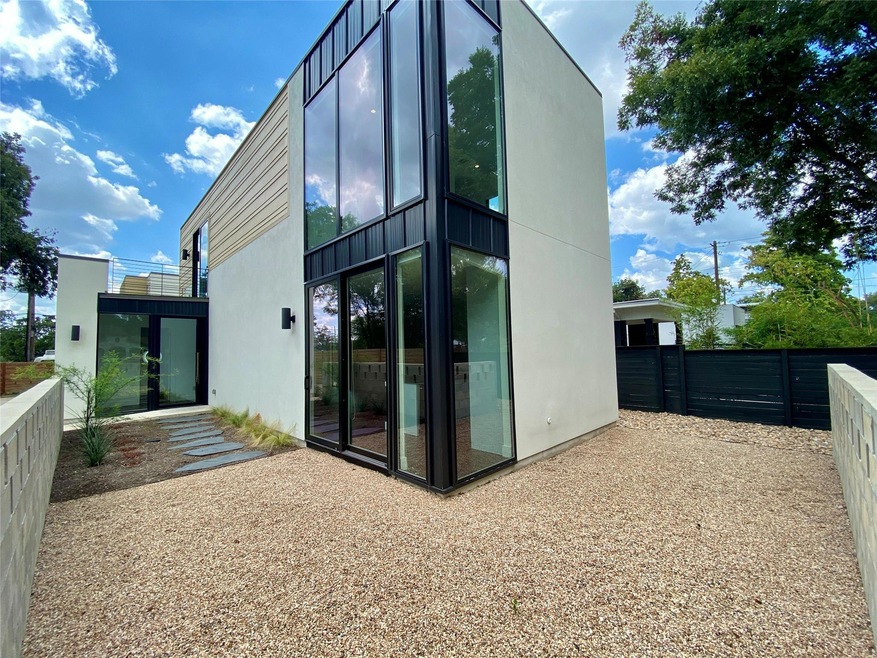 Back of house with stucco siding
