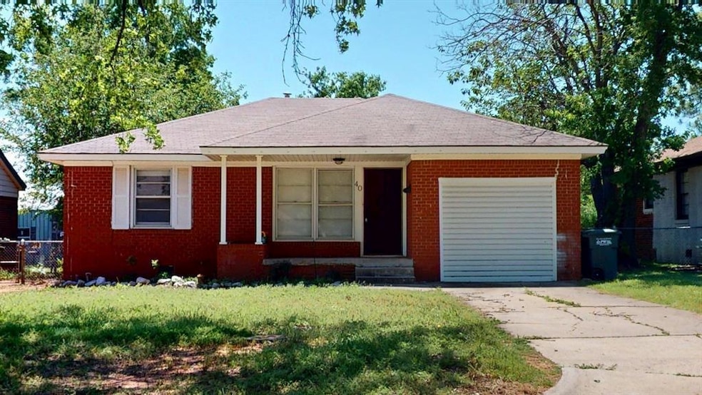 Single story home featuring entry steps, brick sid
