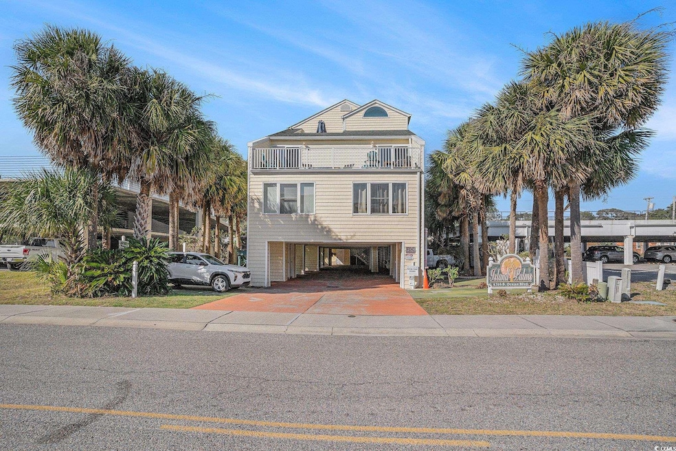 Beach home with a carport and driveway