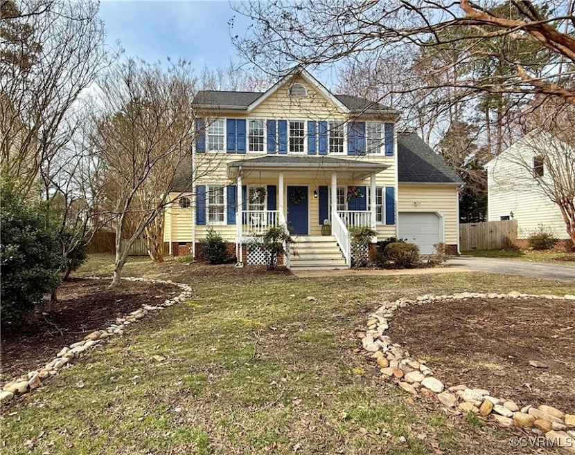 Colonial-style house with a shingled roof, covered