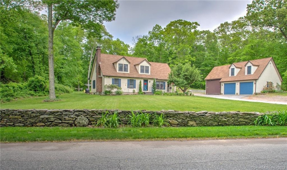Beautiful stone wall boarding the front yard of th