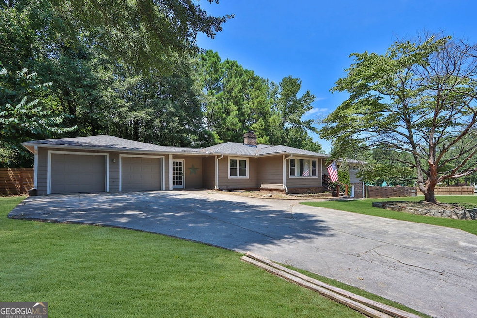 1865 Pucketts Dr SW, Lilburn, GA 30047 - photo 1