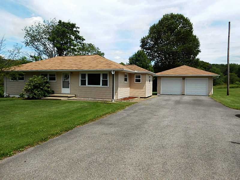 Exterior Front. Paved driveway, 2 car garage