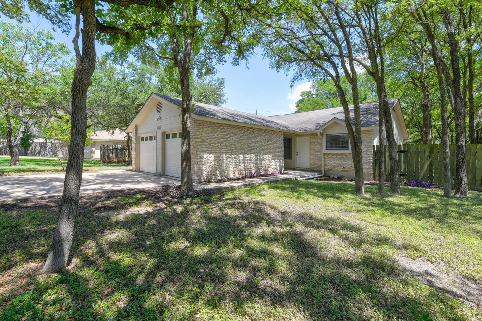 Ranch-style house with brick siding, a garage, an