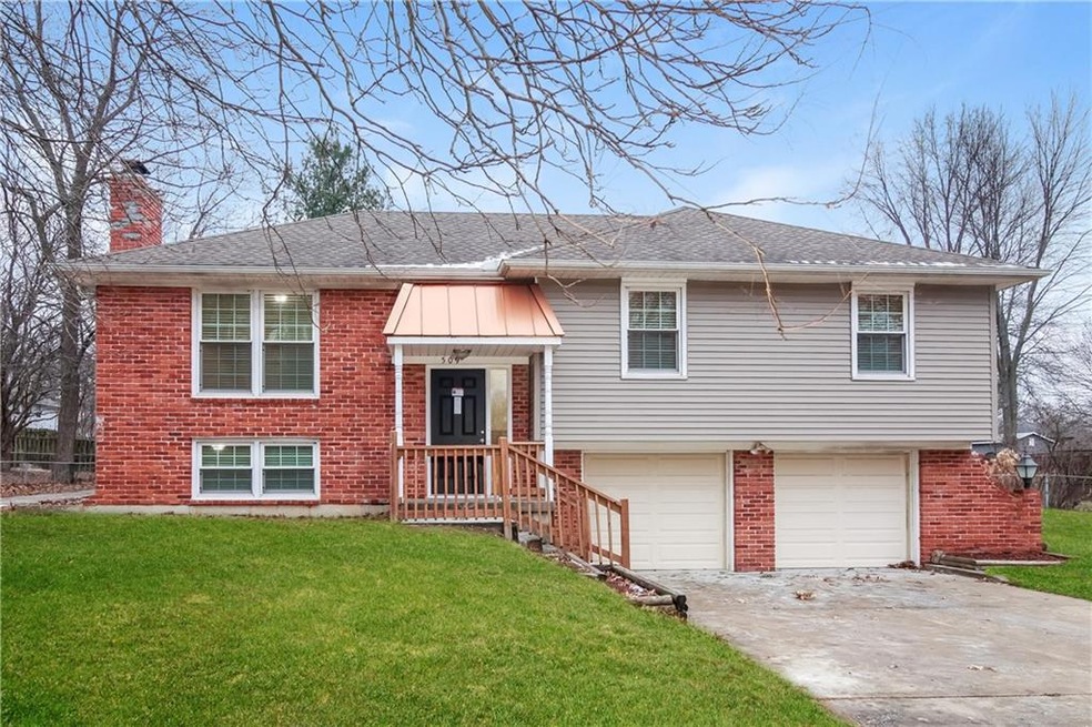 509 S Adams St, Raymore, MO 64083 - photo 1