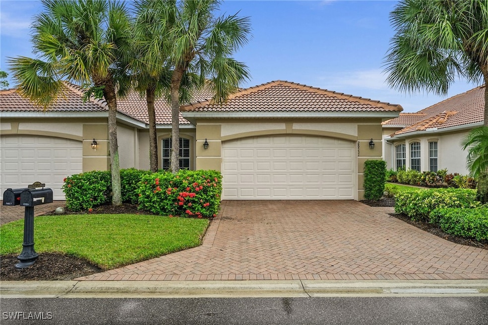 Mediterranean / spanish-style house featuring a ga