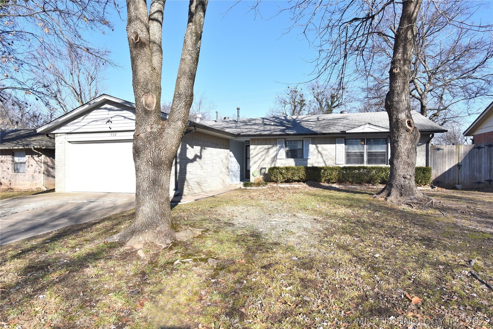 House located on tree lined street in established