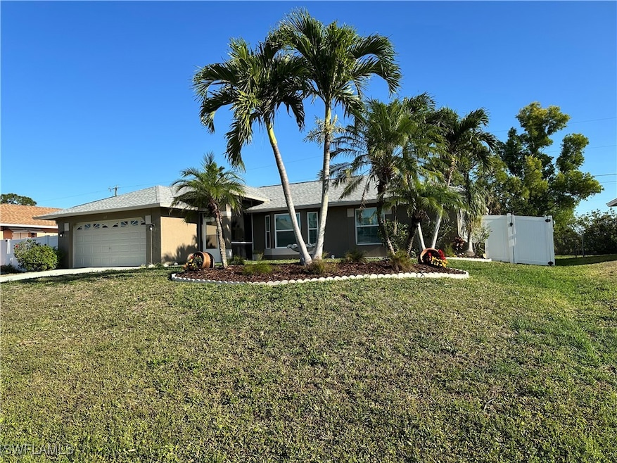 Ranch-style house with stucco siding, driveway, a