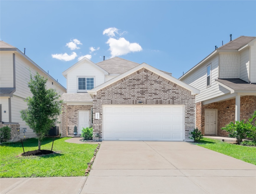 This beautifully maintained brick-front home welco