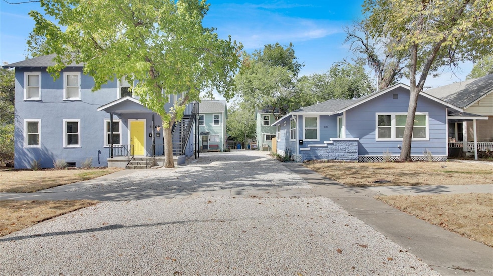 View of front of property with driveway and a shingled roof