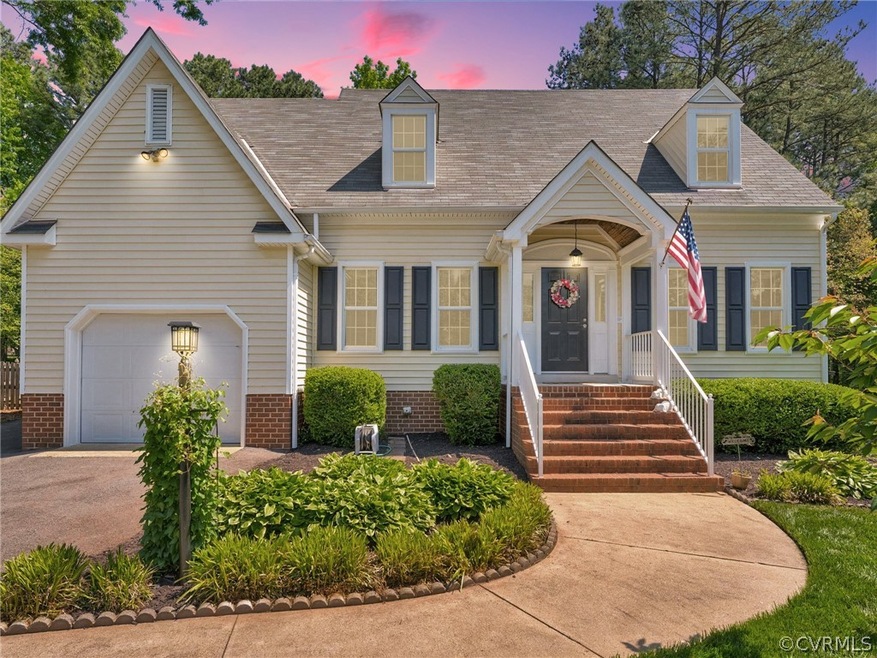 Cape cod-style house with a garage