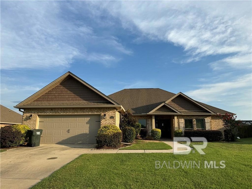 View of front facade with a garage and a front lawn