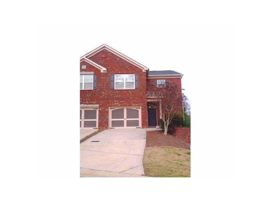 Exterior Front. This brick, corner end unit is a t