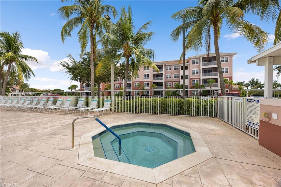 View of swimming pool featuring a patio, fence, an