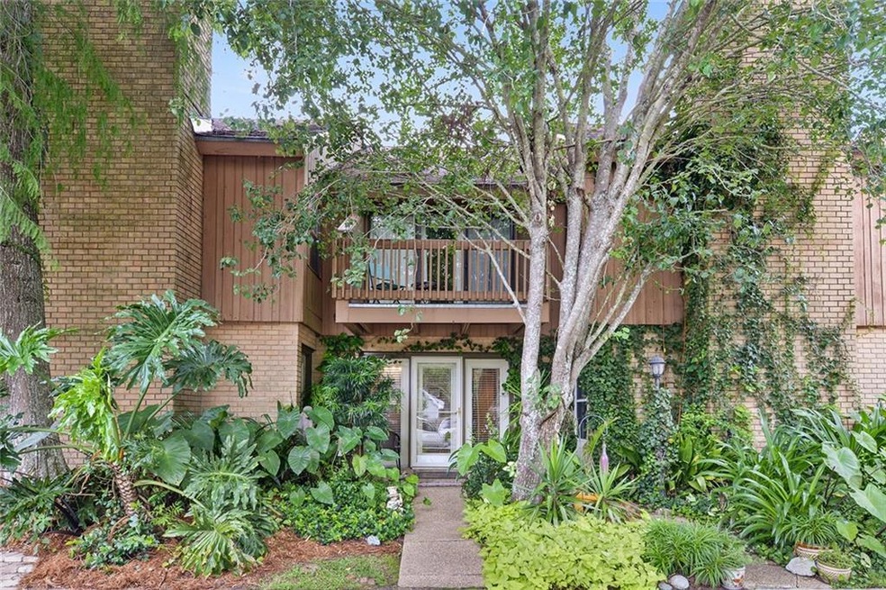 Tropical entrance to this lovely townhome