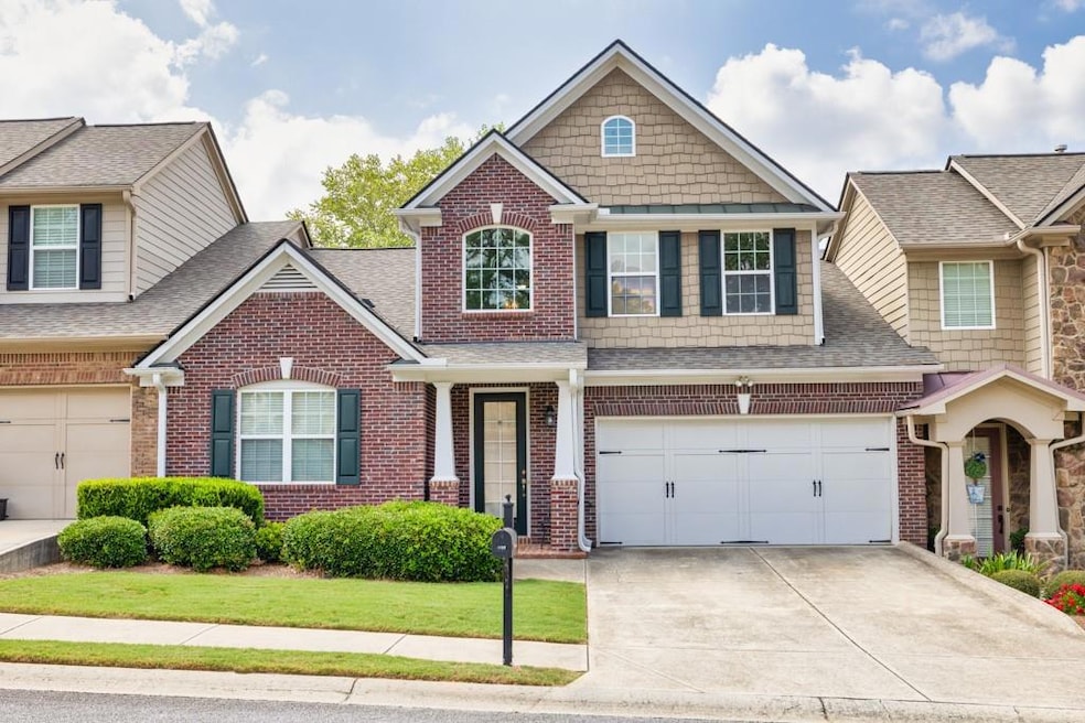 Craftsman house with a front yard and a garage