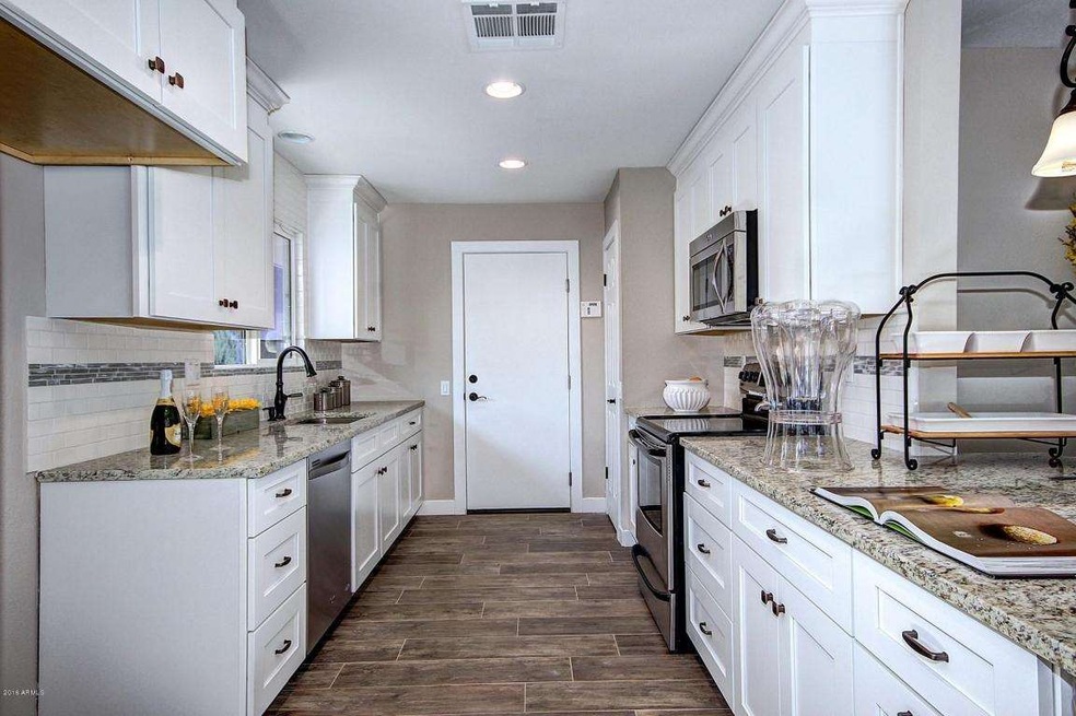 9627 W Lindgren Ave, Sun City, AZ 85373 - photo 1