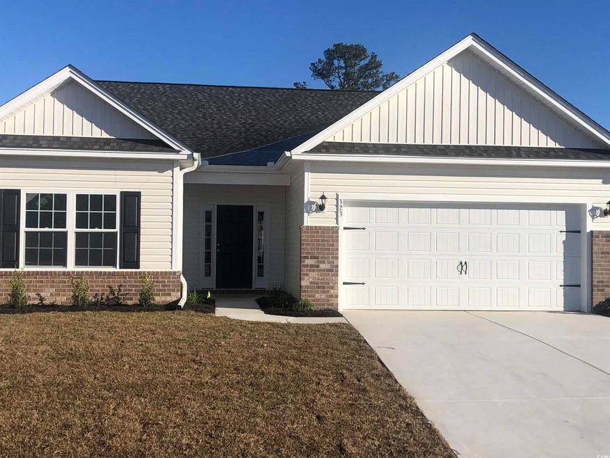 View of front of house featuring a garage and a fr