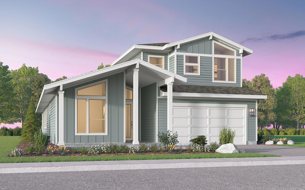 View of front of home featuring roof with shingle
