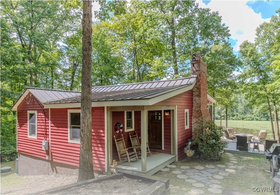 View of outdoor structure with an outdoor fire pit