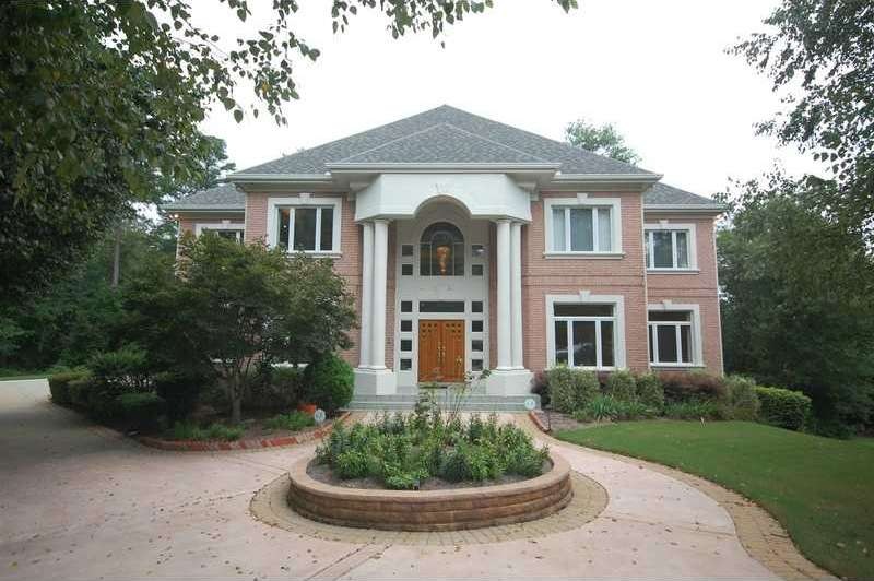 Exterior Front. Stately entrance to all brick cust