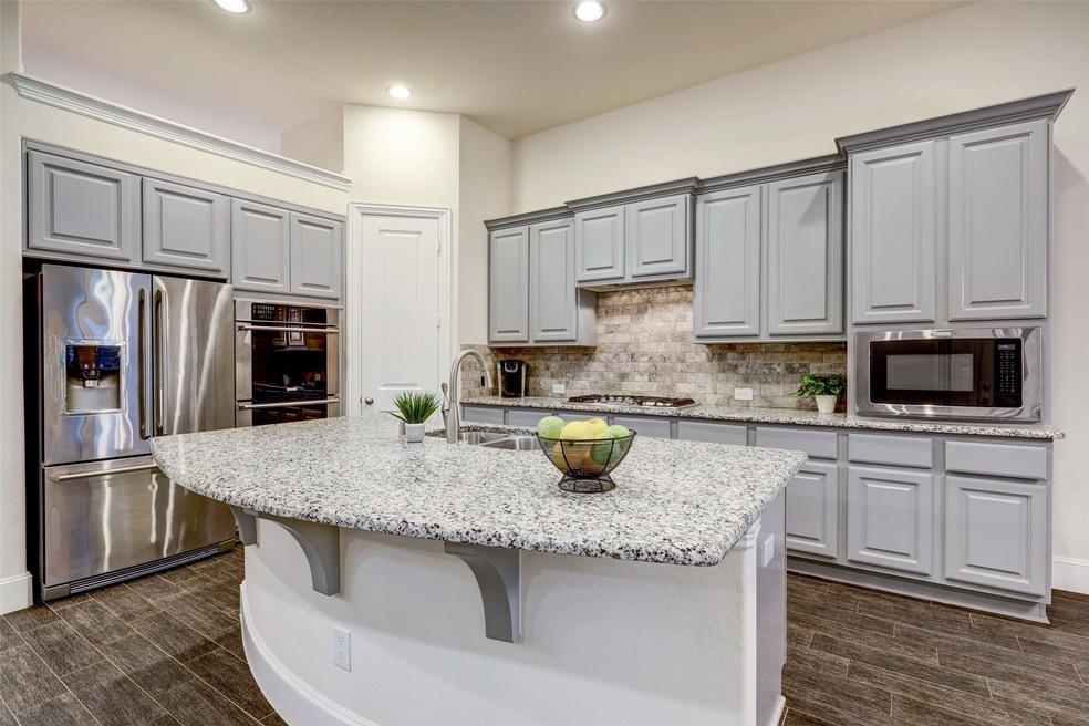 Gourmet dream kitchen with open concept! Perfect for entertaining. Island has space for 4 barstools.
